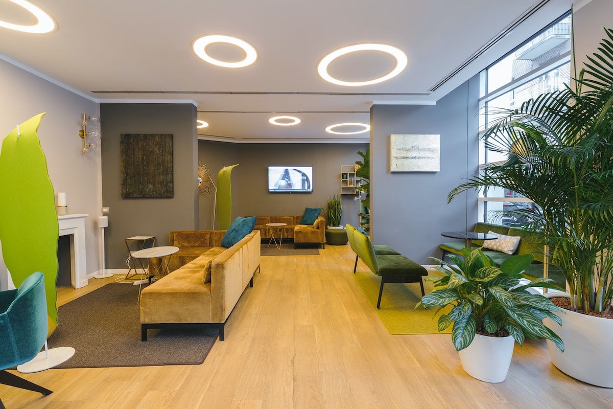 a dispensary waiting room with modern lighting and vibrant colors creates a vibe